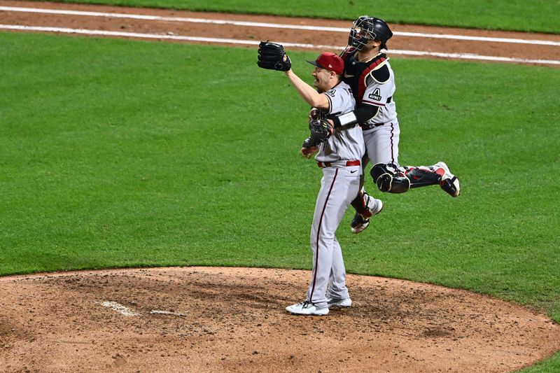 Oct 24, 2023; Philadelphia, Pennsylvania, USA; Arizona Diamondbacks relief pitcher Paul Sewald (38) reacts with  catcher Gabriel Moreno (14) after defeating the Philadelphia Phillies in game seven of the NLCS for the 2023 MLB playoffs at Citizens Bank Park. Mandatory Credit: Kyle Ross-USA TODAY Sports