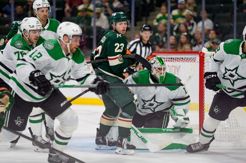Sep 25, 2025; Saint Paul, Minnesota, USA; Minnesota Wild center Marco Rossi (23) screens Dallas Stars goaltender Casey DeSmith (1) with a flurry of players around the net in the third period at Grand Casino Arena. Mandatory Credit: Matt Blewett-Imagn Images