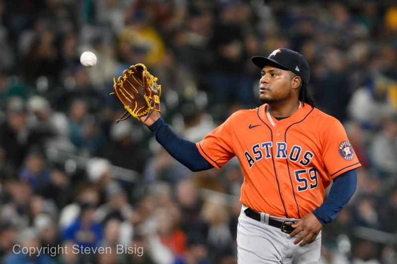 Sep 27, 2023; Seattle, Washington, USA; Houston Astros starting pitcher Framber Valdez (59) receives a new ball during the second inning against the Seattle Mariners at T-Mobile Park. Mandatory Credit: Steven Bisig-USA TODAY Sports