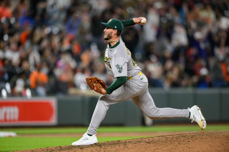 Apr 26, 2024; Baltimore, Maryland, USA; Oakland Athletics pitcher Mitch Spence (40) throws a pitch during the seventh inning against the Baltimore Orioles at Oriole Park at Camden Yards. Mandatory Credit: Reggie Hildred-USA TODAY Sports