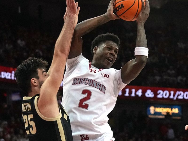 Feb 4, 2024; Madison, Wisconsin, USA; Wisconsin guard AJ Storr (2) passes the ball while being guarded by guard Ethan Morton (25) during the second half at Kohl Center. Mandatory Credit: Mark Hoffman-USA TODAY Sports