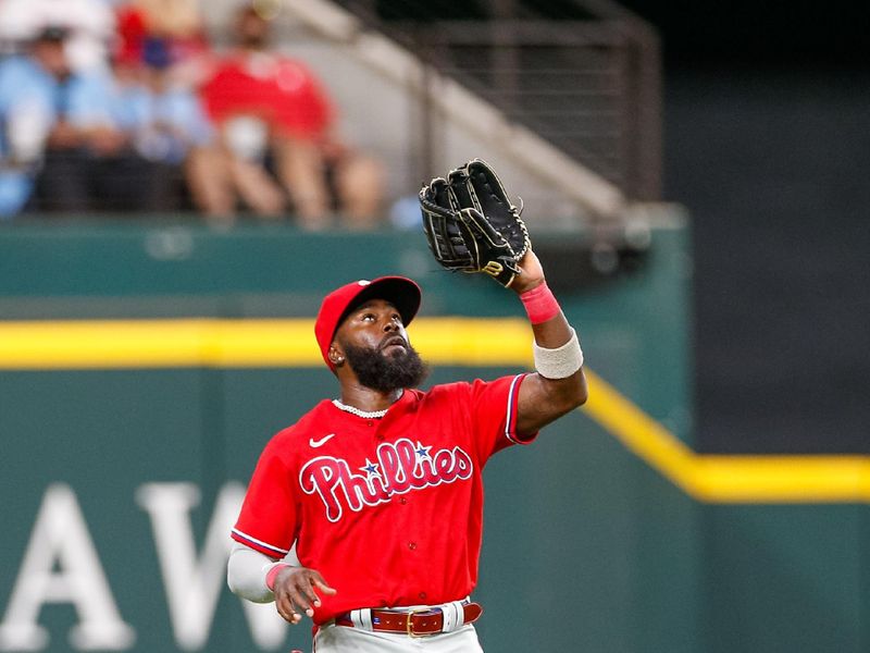 Apr 2, 2023; Arlington, Texas, USA; Philadelphia Phillies left fielder Josh Harrison (2) makes a catch during the second inning against the Texas Rangers at Globe Life Field. Mandatory Credit: Andrew Dieb-USA TODAY Sports