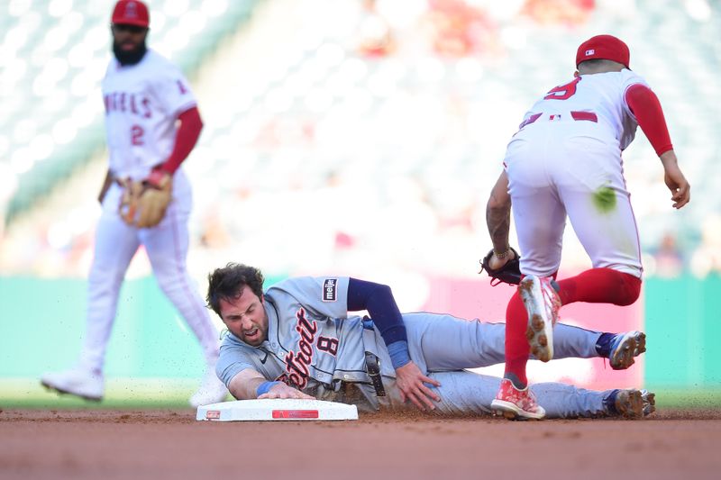 Jun 27, 2024; Anaheim, California, USA; Detroit Tigers third baseman Matt Vierling (8) is caught stealing second by Los Angeles Angels shortstop Zach Neto (9) during the first inning at Angel Stadium. Mandatory Credit: Gary A. Vasquez-USA TODAY Sports