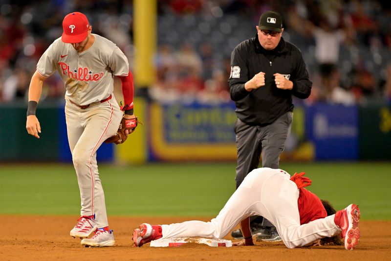 Apr 29, 2024; Anaheim, California, USA; Los Angeles Angels designated hitter Cole Tucker (8) is caught stealing by Philadelphia Phillies shortstop Trea Turner (7) in the sixth inning at Angel Stadium. Mandatory Credit: Jayne Kamin-Oncea-USA TODAY Sports