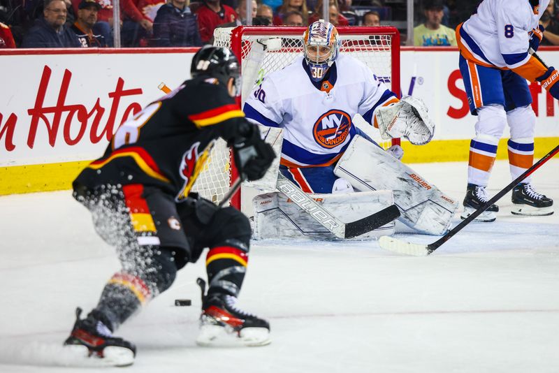 Nov 18, 2023; Calgary, Alberta, CAN; New York Islanders goaltender Ilya Sorokin (30) guards his net against the Calgary Flames during the overtime period at Scotiabank Saddledome. Mandatory Credit: Sergei Belski-USA TODAY Sports