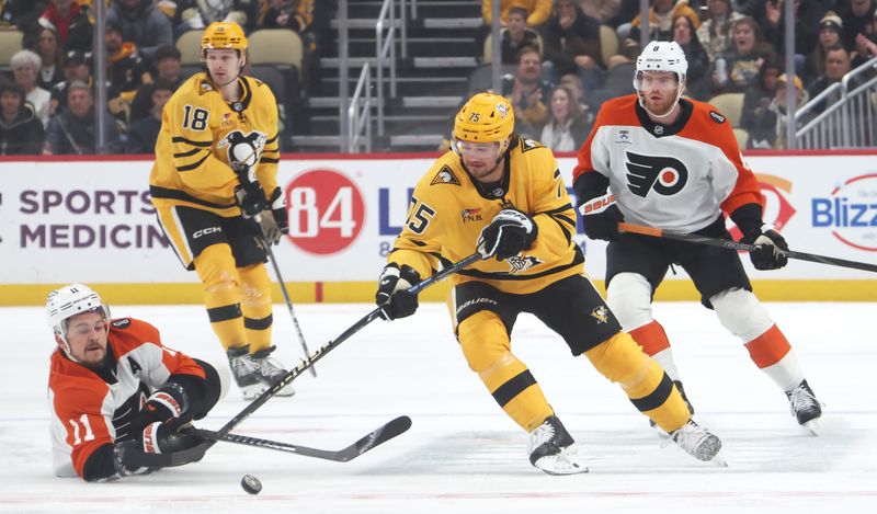 Jan 15, 2026; Pittsburgh, Pennsylvania, USA;  Pittsburgh Penguins defenseman Connor Clifton (75) moves the puck ahead of Philadelphia Flyers right wing Travis Konecny (11) during the first period at PPG Paints Arena. Mandatory Credit: Charles LeClaire-Imagn Images