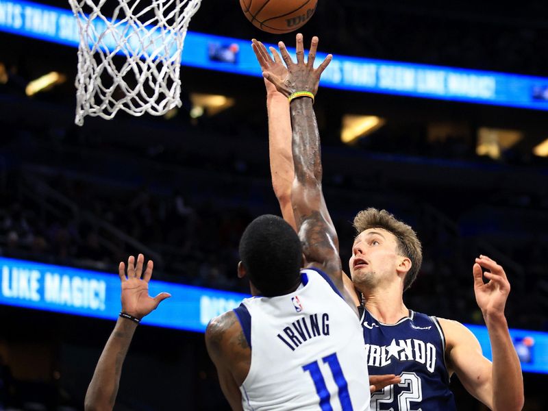 ORLANDO, FLORIDA - NOVEMBER 06: Franz Wagner #22 of the Orlando Magic drives on  Kyrie Irving #11 of the Dallas Mavericks during a game  at Amway Center on November 06, 2023 in Orlando, Florida. (Photo by Mike Ehrmann/Getty Images) NOTE TO USER: User expressly acknowledges and agrees that, by downloading and or using this photograph, User is consenting to the terms and conditions of the Getty Images License Agreement. (Photo by Mike Ehrmann/Getty Images)