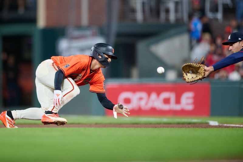 Jun 6, 2025; San Francisco, California, USA; Atlanta Braves first baseman Matt Olson (28) catches a pickoff throw against San Francisco Giants center fielder Jung Hoo Lee (51) during the seventh inning at Oracle Park. Mandatory Credit: Robert Edwards-Imagn Images