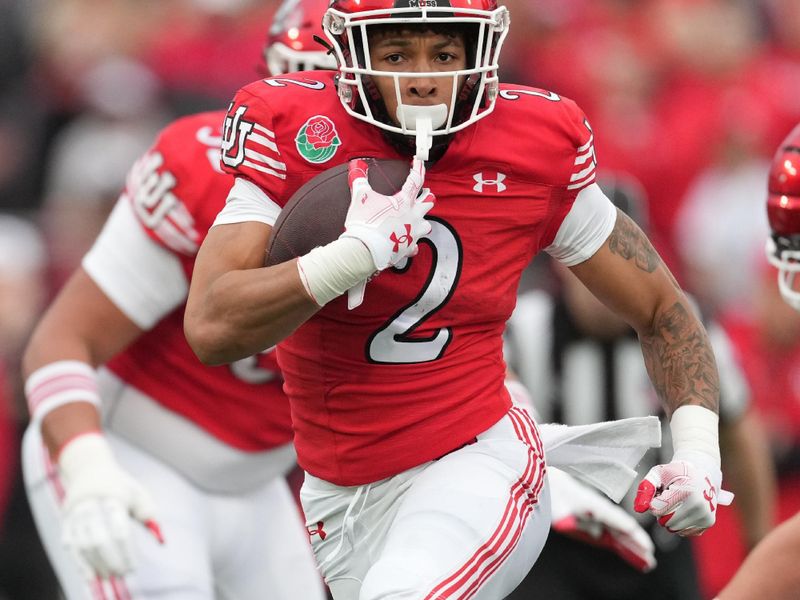 Jan 2, 2023; Pasadena, California, USA; Utah Utes running back Micah Bernard (2) runs in the first half against the Penn State Nittany Lions in the 109th Rose Bowl game at the Rose Bowl. Mandatory Credit: Kirby Lee-USA TODAY Sports