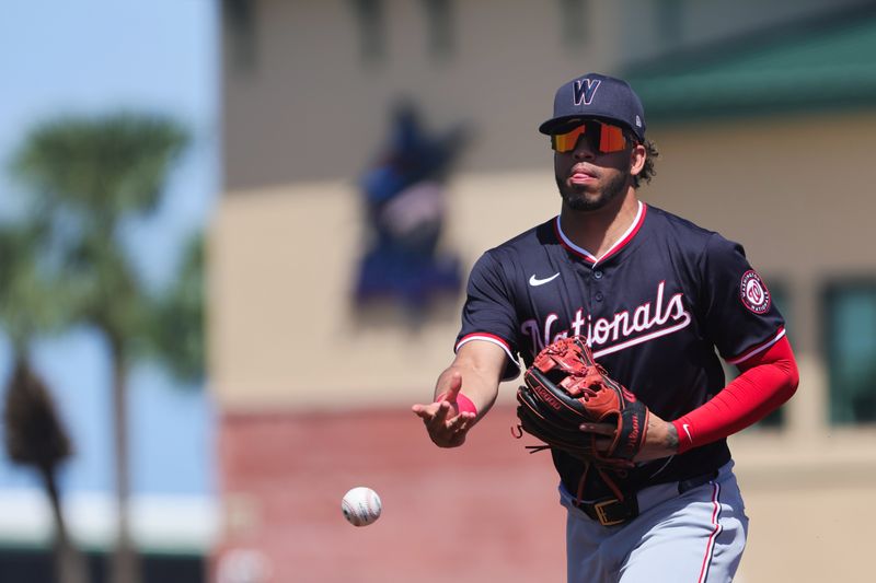 Mar 11, 2024; Jupiter, Florida, USA; Washington Nationals second baseman Luis Garcia Jr. (2) tosses the ball to first base to retire St. Louis Cardinals center fielder Michael Siani (not pictured) during the second inning at Roger Dean Chevrolet Stadium. Mandatory Credit: Sam Navarro-USA TODAY Sports