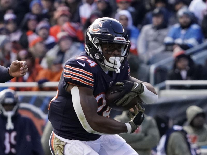 Chicago Bears running back Khalil Herbert (24) runs the ball against the Detroit Lions during an NFL football game Sunday, Nov. 13, 2022, in Chicago. (AP Photo/David Banks)