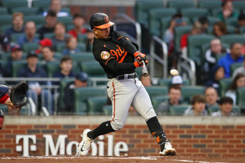 May 5, 2023; Atlanta, Georgia, USA; Baltimore Orioles second baseman Ramon Urias (29) hits a single against the Atlanta Braves in the second inning at Truist Park. Mandatory Credit: Brett Davis-USA TODAY Sports