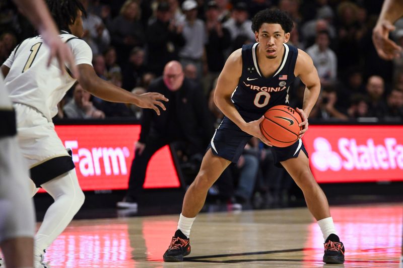 Jan 21, 2023; Winston-Salem, North Carolina, USA;  Virginia Cavaliers guard Kihei Clark (0) looks for a pass against the Wake Forest Demon Deacons during the second half at Lawrence Joel Veterans Memorial Coliseum. Mandatory Credit: William Howard-USA TODAY Sports