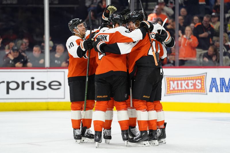Oct 20, 2025; Philadelphia, Pennsylvania, USA; Philadelphia Flyers teammates celebrate after a goal from right wing Tyson Foerster (71) against the Seattle Kraken in the second period at Xfinity Mobile Arena. Mandatory Credit: Kyle Ross-Imagn Images