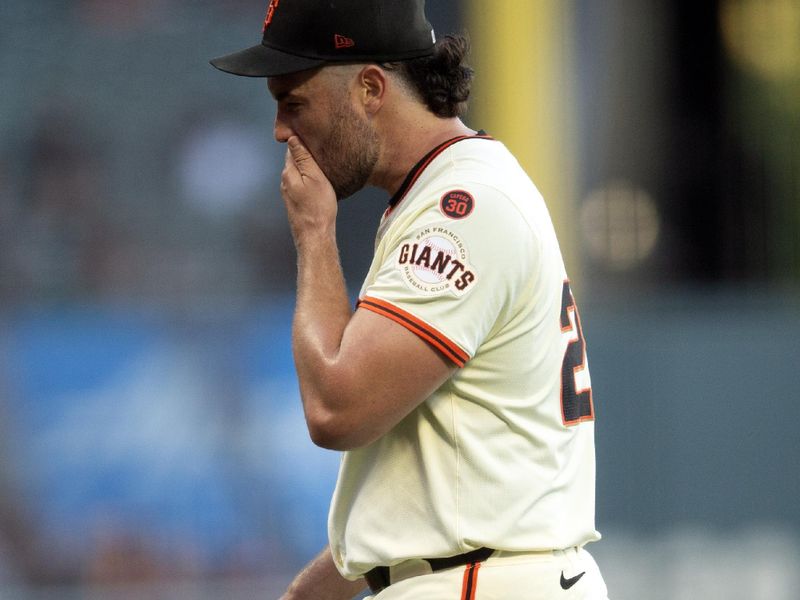 Aug 14, 2024; San Francisco, California, USA; San Francisco Giants starting pitcher Robbie Ray (23) walks off the field after being removed for a reliever during the first inning against the Atlanta Braves at Oracle Park. Mandatory Credit: D. Ross Cameron-USA TODAY Sports