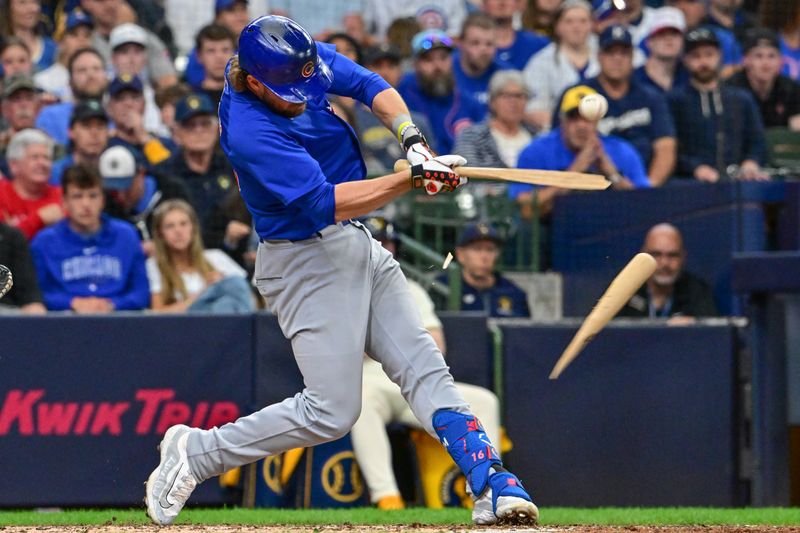 May 27, 2024; Milwaukee, Wisconsin, USA; Chicago Cubs first baseman Patrick Wisdom (16) breaks his bat while hitting an infield single in the seventh inning against the Milwaukee Brewers at American Family Field. Mandatory Credit: Benny Sieu-USA TODAY Sports