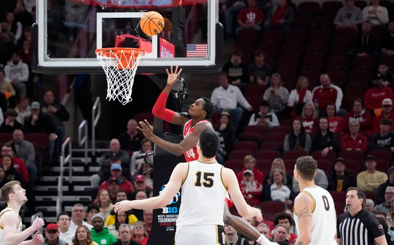 Mar 11, 2023; Chicago, IL, USA; Ohio State Buckeyes center Felix Okpara (34) scores against the Purdue Boilermakers during the first half at United Center. Mandatory Credit: David Banks-USA TODAY Sports