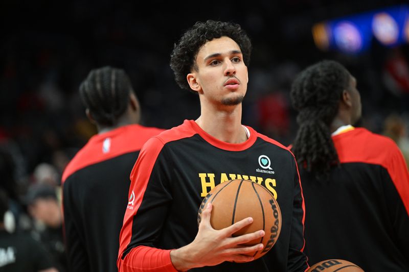 ATLANTA, GEORGIA - MARCH 04: Zaccharie Risacher #10 of the Atlanta Hawks warms up before the game against the Milwaukee Bucks at State Farm Arena on March 04, 2025 in Atlanta, Georgia. NOTE TO USER: User expressly acknowledges and agrees that, by downloading and or using this photograph, User is consenting to the terms and conditions of the Getty Images License Agreement.  (Photo by Paras Griffin/Getty Images)