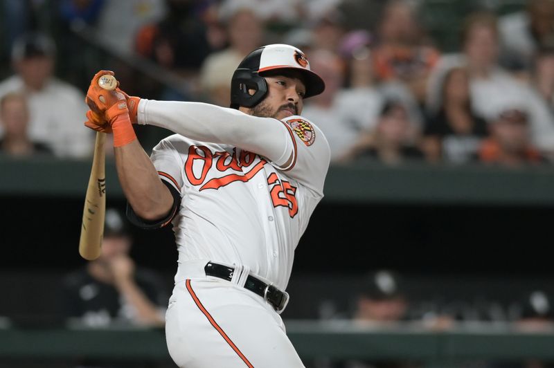 Aug 28, 2023; Baltimore, Maryland, USA; Baltimore Orioles right fielder Anthony Santander (25) swings through a three run home run in the eighth inning against the Chicago White Sox  at Oriole Park at Camden Yards. Mandatory Credit: Tommy Gilligan-USA TODAY Sports