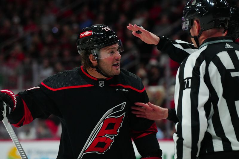 Mar 10, 2024; Raleigh, North Carolina, USA;  Carolina Hurricanes left wing Brendan Lemieux (28) reacts to the linesmen against the Calgary Flames during the first period at PNC Arena. Mandatory Credit: James Guillory-USA TODAY Sports