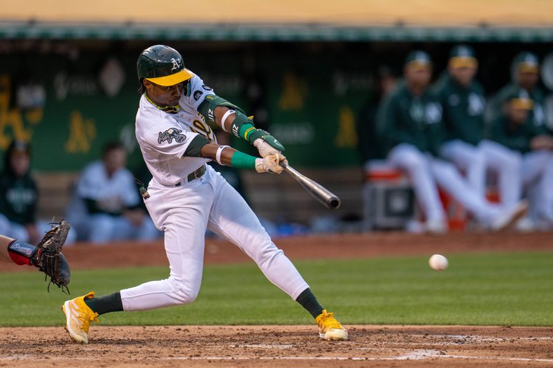 May 30, 2023; Oakland, California, USA;  Oakland Athletics center fielder Esteury Ruiz (1) hits a RBI single during the fifth inning against the Atlanta Braves at Oakland-Alameda County Coliseum. Mandatory Credit: Neville E. Guard-USA TODAY Sports