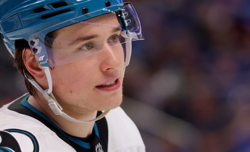 Mar 4, 2025; Buffalo, New York, USA;  San Jose Sharks center Macklin Celebrini (71) during a stoppage in play against the Buffalo Sabres at KeyBank Center. Mandatory Credit: Timothy T. Ludwig-Imagn Images