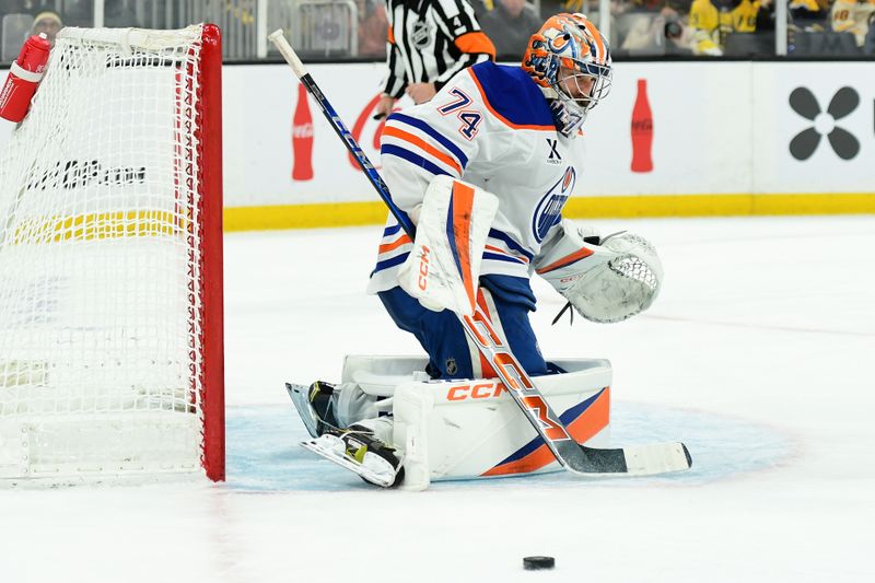 Jan 7, 2025; Boston, Massachusetts, USA; Edmonton Oilers goaltender Stuart Skinner (74) makes a save during the third period against the Boston Bruins at TD Garden. Mandatory Credit: Bob DeChiara-Imagn Images