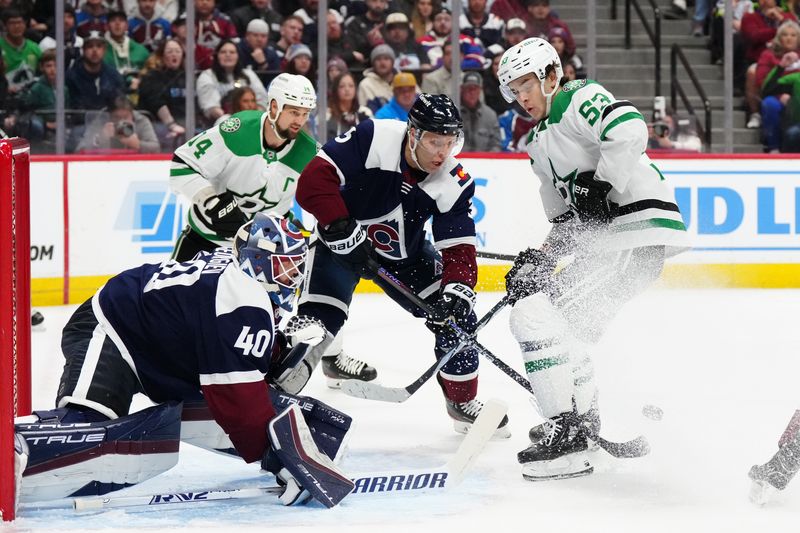 Apr 7, 2024; Denver, Colorado, USA; Dallas Stars center Wyatt Johnston (53) and Colorado Avalanche goaltender Alexandar Georgiev (40) and defenseman Jack Johnson (3) during the first period at Ball Arena. Mandatory Credit: Ron Chenoy-USA TODAY Sports