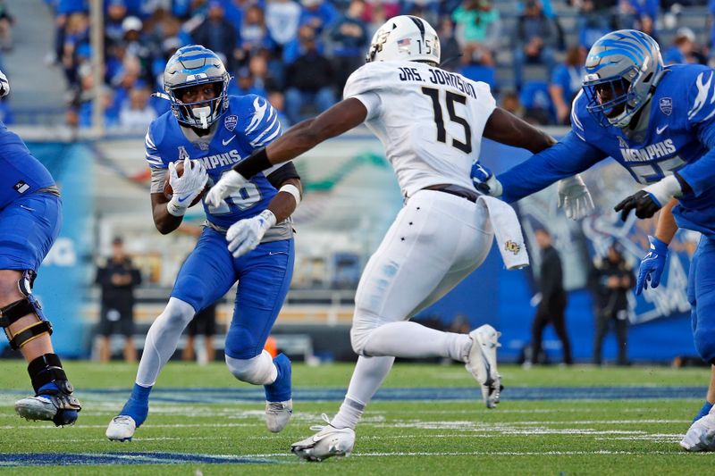 Nov 5, 2022; Memphis, Tennessee, USA; Memphis Tigers running back Asa Martin (28) runs the ball during the second half against the UCF Knights at Liberty Bowl Memorial Stadium. Mandatory Credit: Petre Thomas-USA TODAY Sports