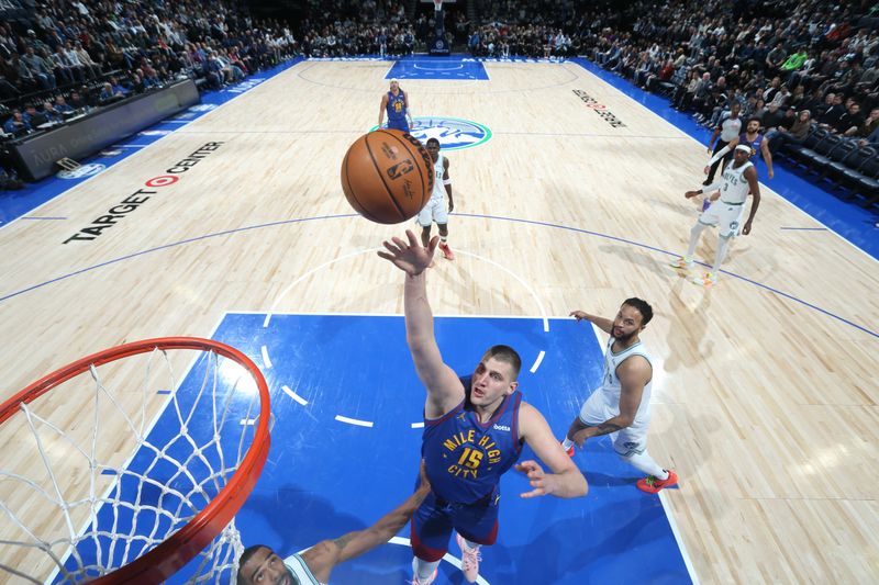 MINNEAPOLIS, MN -  MARCH 19: Nikola Jokic #15 of the Denver Nuggets shoots the ball during the game against the Minnesota Timberwolves on March 19, 2024 at Target Center in Minneapolis, Minnesota. NOTE TO USER: User expressly acknowledges and agrees that, by downloading and or using this Photograph, user is consenting to the terms and conditions of the Getty Images License Agreement. Mandatory Copyright Notice: Copyright 2024 NBAE (Photo by David Sherman/NBAE via Getty Images)