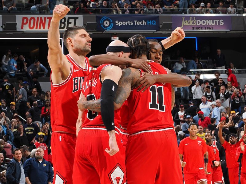 INDIANAPOLIS, IN - MARCH 13:  Nikola Vucevic #9 of the Chicago Bulls Ayo Dosunmu #12 of the Chicago Bulls Alex Caruso #6 of the Chicago Bulls & DeMar DeRozan #11 of the Chicago Bulls embrace after the game on March 13, 2024 at Gainbridge Fieldhouse in Indianapolis, Indiana. NOTE TO USER: User expressly acknowledges and agrees that, by downloading and or using this Photograph, user is consenting to the terms and conditions of the Getty Images License Agreement. Mandatory Copyright Notice: Copyright 2024 NBAE (Photo by Ron Hoskins/NBAE via Getty Images)