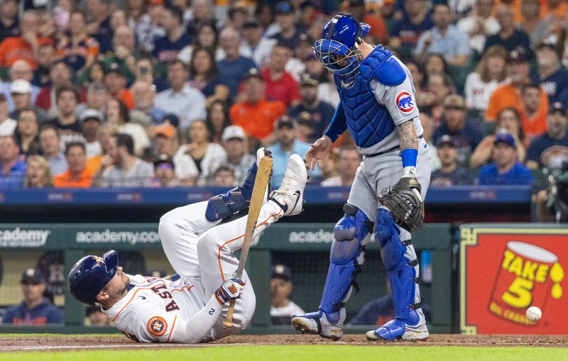 May 16, 2023; Houston, Texas, USA; Houston Astros third baseman Alex Bregman (2) gets hit in the foot by a pitch against the Chicago Cubs in the fourth inning at Minute Maid Park. Mandatory Credit: Thomas Shea-USA TODAY Sports