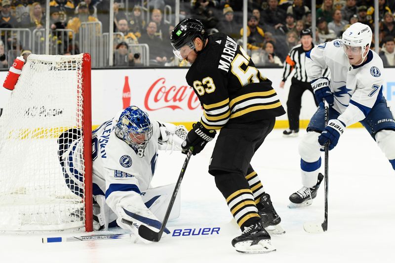 Feb 13, 2024; Boston, Massachusetts, USA;  Boston Bruins left wing Brad Marchand (63) looks for a rebound in front of Tampa Bay Lightning goaltender Andrei Vasilevskiy (88) during the first period at TD Garden. Mandatory Credit: Bob DeChiara-USA TODAY Sports