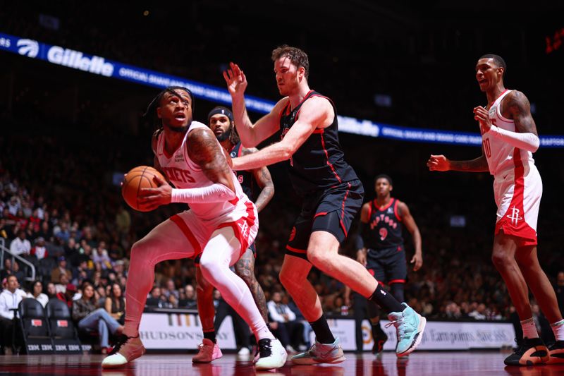 TORONTO, CANADA - FEBRUARY 9: Jakob Poeltl #19 of the Toronto Raptors plays defense during the game against the Houston Rockets on February 9, 2024 at the Scotiabank Arena in Toronto, Ontario, Canada.  NOTE TO USER: User expressly acknowledges and agrees that, by downloading and or using this Photograph, user is consenting to the terms and conditions of the Getty Images License Agreement.  Mandatory Copyright Notice: Copyright 2024 NBAE (Photo by Vaughn Ridley/NBAE via Getty Images)