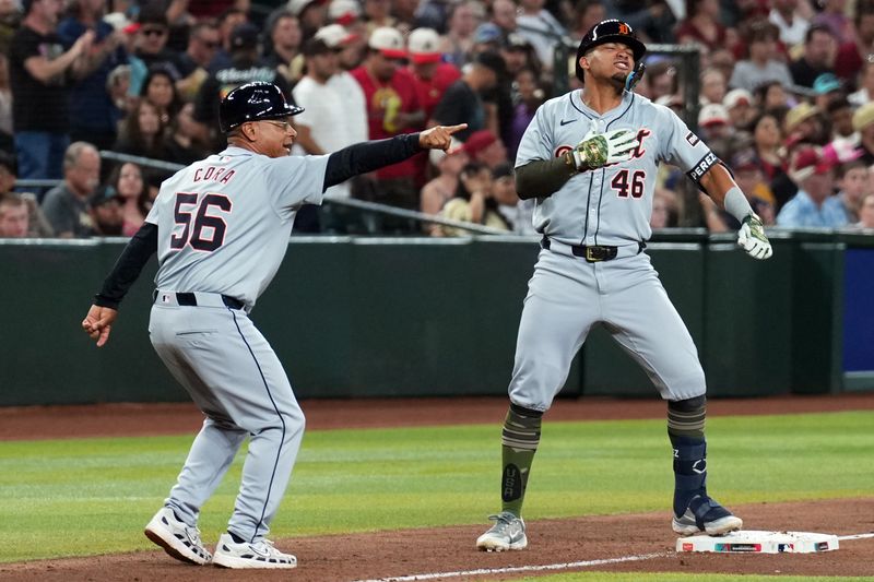 May 18, 2024; Phoenix, Arizona, USA; Detroit Tigers outfielder Wenceel Pérez (46) celebrates a three RBI triple alongside Detroit Tigers third base coach Joey Cora (56) during the seventh inning against the Arizona Diamondbacks at Chase Field. Mandatory Credit: Joe Camporeale-USA TODAY Sports