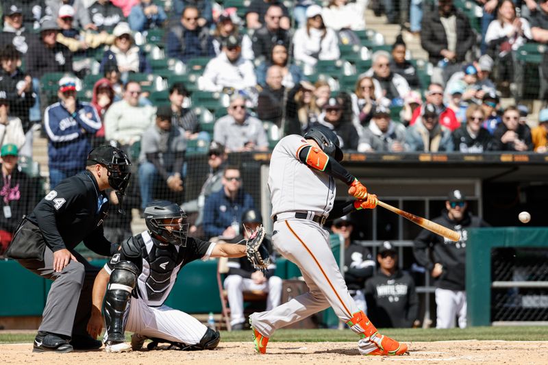 Apr 6, 2023; Chicago, Illinois, USA; San Francisco Giants first baseman Joc Pederson (23) hits a two-run single against the Chicago White Sox during the fourth inning at Guaranteed Rate Field. Mandatory Credit: Kamil Krzaczynski-USA TODAY Sports