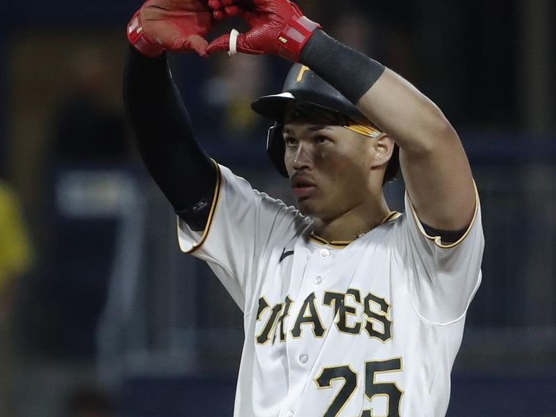 Sep 12, 2023; Pittsburgh, Pennsylvania, USA; Pittsburgh Pirates catcher Endy Rodriguez (25) reacts at second base with a double against the Washington Nationals during the fifth inning at PNC Park. Mandatory Credit: Charles LeClaire-USA TODAY Sports