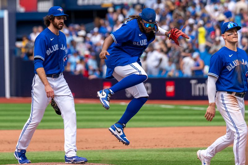 Jul 20, 2023; Toronto, Ontario, CAN; Toronto Blue Jays first baseman Vladimir Guerrero Jr. (27) reacts after defeating the San Diego Padres at Rogers Centre. Mandatory Credit: Kevin Sousa-USA TODAY Sports