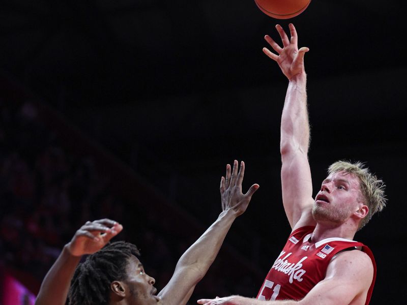 Jan 17, 2024; Piscataway, New Jersey, USA; Nebraska Cornhuskers forward Rienk Mast (51) shoots the ball against Rutgers Scarlet Knights forward Antwone Woolfolk (13) during the first half at Jersey Mike's Arena. Mandatory Credit: Vincent Carchietta-USA TODAY Sports