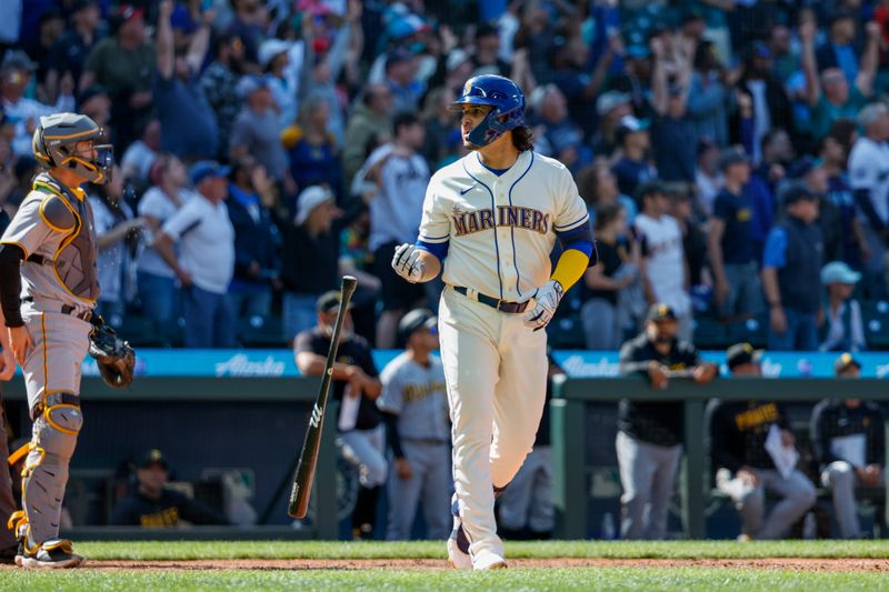 May 28, 2023; Seattle, Washington, USA; Seattle Mariners third baseman Eugenio Suarez (28) flips his bat after hitting a walk-off three-run home run against the Pittsburgh Pirates during the tenth inning at T-Mobile Park. Seattle defeated Pittsburgh, 6-3. Mandatory Credit: Joe Nicholson-USA TODAY Sports