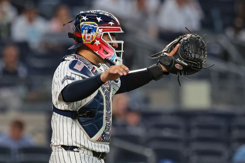 Sep 11, 2024; Bronx, New York, USA; New York Yankees catcher Jose Trevino (39) signals during the first inning against the Kansas City Royals at Yankee Stadium. Mandatory Credit: Vincent Carchietta-Imagn Images