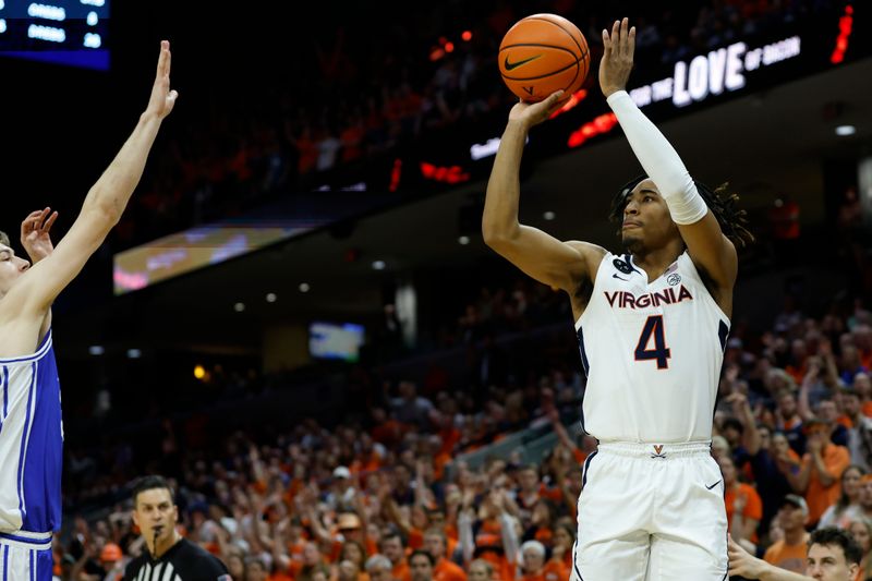 Feb 11, 2023; Charlottesville, Virginia, USA; Virginia Cavaliers guard Armaan Franklin (4) makes a three point field goal as Duke Blue Devils center Kyle Filipowski (30) defends in the final minute in overtime at John Paul Jones Arena. Mandatory Credit: Geoff Burke-USA TODAY Sports