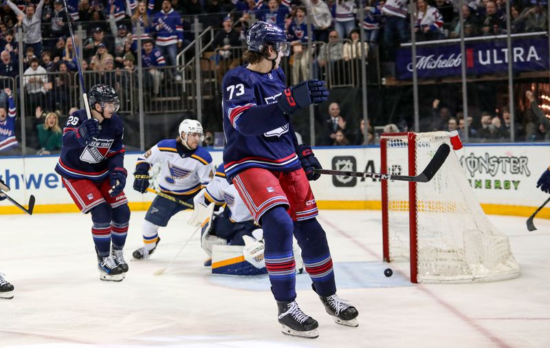 Mar 9, 2024; New York, New York, USA; St. Louis Blues goalie Jordan Binnington (50) tries to stop a shot by New York Rangers center Matt Rempe (73) which was at first called a goal but then overruled after replay during the second period at Madison Square Garden. Mandatory Credit: Danny Wild-USA TODAY Sports