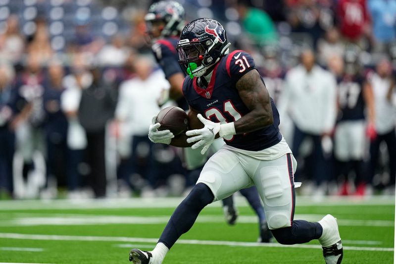 Houston Texans running back Dameon Pierce (31) runs Miami Dolphins during an NFL preseason football game Saturday, Aug. 19, 2023, in Houston. (AP Photo/Eric Gay)