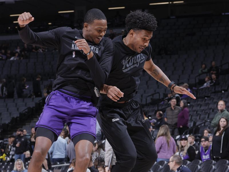 SACRAMENTO, CA - JANUARY 7:  De'Aaron Fox #5 of the Sacramento Kings & Assistant Coach Leandro Barbosa of the Sacramento Kings celebrate before the game on January 7, 2024 at Golden 1 Center in Sacramento, California. NOTE TO USER: User expressly acknowledges and agrees that, by downloading and or using this Photograph, user is consenting to the terms and conditions of the Getty Images License Agreement. Mandatory Copyright Notice: Copyright 2024 NBAE (Photo by Rocky Widner/NBAE via Getty Images)