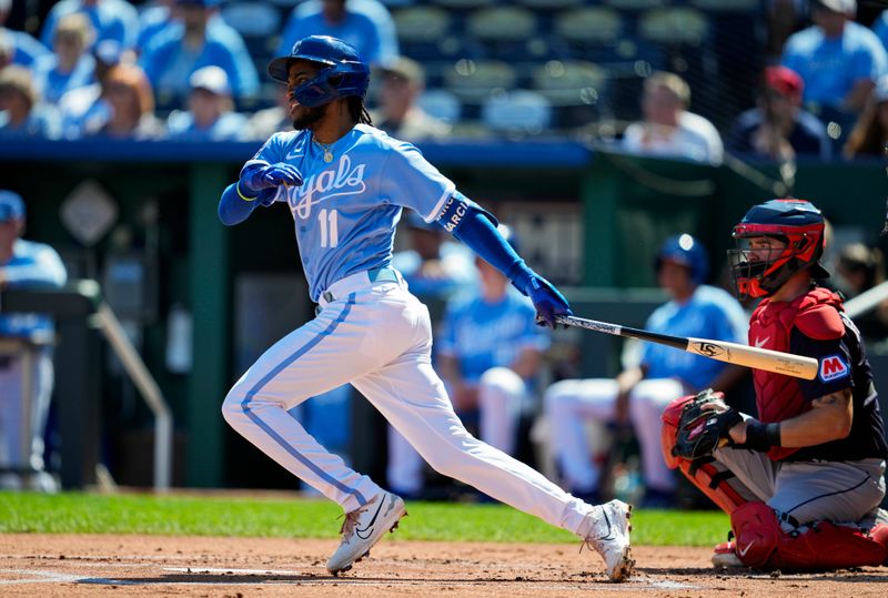 Sep 20, 2023; Kansas City, Missouri, USA; Kansas City Royals third baseman Maikel Garcia (11) hits a double against the Cleveland Guardians during the first inning at Kauffman Stadium. Mandatory Credit: Jay Biggerstaff-USA TODAY Sports