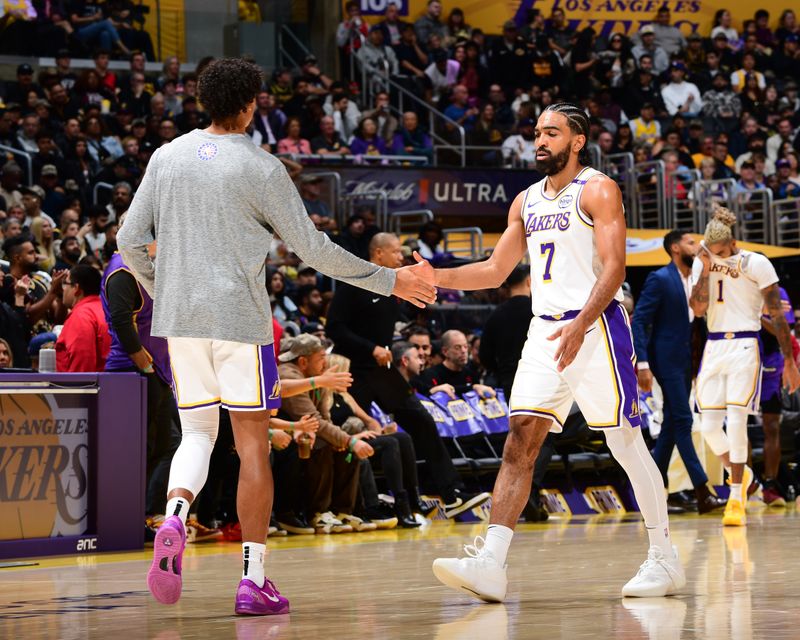 LOS ANGELES, CA - NOVEMBER 10: Gabe Vincent #7 and Max Christie #12 of the Los Angeles Lakers high five during the game against the Toronto Raptors on November 10, 2024 at Crypto.Com Arena in Los Angeles, California. NOTE TO USER: User expressly acknowledges and agrees that, by downloading and/or using this Photograph, user is consenting to the terms and conditions of the Getty Images License Agreement. Mandatory Copyright Notice: Copyright 2024 NBAE (Photo by Adam Pantozzi/NBAE via Getty Images)