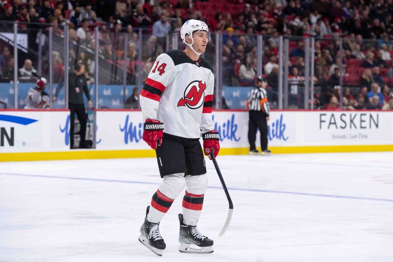 Oct 17, 2024; Ottawa, Ontario, CAN; New Jersey Devils right wing Nathan Bastian (14) skates to the bench after scoring a goal in the second period against the Ottawa Senators at the Canadian Tire Centre. Mandatory Credit: Marc DesRosiers-Imagn Images