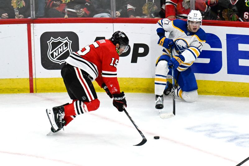 Oct 19, 2024; Chicago, Illinois, USA;  Buffalo Sabres right wing JJ Peterka (77) passes against Chicago Blackhawks center Craig Smith (15) during the third period at the United Center. Mandatory Credit: Matt Marton-Imagn Images