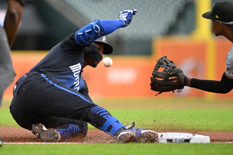 May 29, 2024; Detroit, Michigan, USA;  Detroit Tigers right fielder Wenceel Pérez (46) beats the throw to Pittsburgh Pirates third baseman Ke’Bryan Hayes for a leadoff triple in the first inning at Comerica Park. Mandatory Credit: Lon Horwedel-USA TODAY Sports